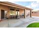 Covered patio with dining area and outdoor seating offers a relaxing space to enjoy the outdoors at 18021 N 53Rd St, Scottsdale, AZ 85254