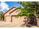 Beautiful home with desert landscaping and a three-car garage at 18021 N 53Rd St, Scottsdale, AZ 85254