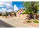 Beautiful home with desert landscaping and a three-car garage at 18021 N 53Rd St, Scottsdale, AZ 85254