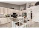 Bright, spacious kitchen with an island, white cabinetry, and stainless steel appliances at 18021 N 53Rd St, Scottsdale, AZ 85254