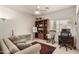 Bright living room featuring a cozy seating area, a bookcase, and a work space at 18021 N 53Rd St, Scottsdale, AZ 85254