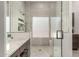 Bathroom shower with grey tile surround and glass doors at 18021 N 53Rd St, Scottsdale, AZ 85254