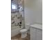 Modern bathroom features a tiled shower with tub, white vanity with hardware, and small window for natural light at 18035 E San Tan Blvd, Queen Creek, AZ 85142