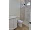 Modern bathroom features a tiled shower with glass enclosure, white vanity with drawers, and hexagon-tiled shower floor at 18035 E San Tan Blvd, Queen Creek, AZ 85142