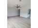 Spacious bedroom with light wood floors and modern ceiling fan at 18035 E San Tan Blvd, Queen Creek, AZ 85142