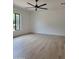 Bright bedroom with large window and light-colored wood floors at 18035 E San Tan Blvd, Queen Creek, AZ 85142