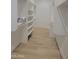 Walk-in closet features custom shelving and wood floors at 18035 E San Tan Blvd, Queen Creek, AZ 85142