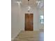 Inviting entryway featuring a wood door and chandelier at 18035 E San Tan Blvd, Queen Creek, AZ 85142