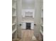 Pantry space includes bright white cabinets, wine rack, mini-fridge, and tiled backsplash in this modern space at 18035 E San Tan Blvd, Queen Creek, AZ 85142