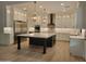 Stunning kitchen with a large island, stainless steel appliances, and custom cabinets at 18035 E San Tan Blvd, Queen Creek, AZ 85142