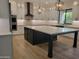 Modern kitchen with a spacious island, designer lighting, and stainless steel appliances at 18035 E San Tan Blvd, Queen Creek, AZ 85142