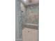 Walk-in shower features decorative tile, a bench, and dual shower heads at 18035 E San Tan Blvd, Queen Creek, AZ 85142