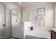 Clean, bright bathroom with shower, soaking tub, and modern fixtures at 1835 S Rockwell St, Gilbert, AZ 85295