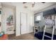 bedroom features a unique lofted bed and provides ample storage space with sliding closet doors at 1835 S Rockwell St, Gilbert, AZ 85295