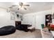 Cozy bedroom features a bed with dark bedding, a beanbag chair, and a functional workspace at 1835 S Rockwell St, Gilbert, AZ 85295