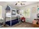Unique bedroom features a lofted bed, playful design elements, and a bright window at 1835 S Rockwell St, Gilbert, AZ 85295
