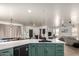 Open kitchen with an island that overlooks the dining and living spaces at 1835 S Rockwell St, Gilbert, AZ 85295