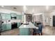 Eat-in kitchen boasting modern appliances, a stylish island, and views of dining area at 1835 S Rockwell St, Gilbert, AZ 85295