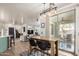 Open-concept living area featuring bar seating and seamless indoor-outdoor flow to a patio at 1835 S Rockwell St, Gilbert, AZ 85295