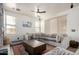 Bright living room featuring an oversized couch, modern fixtures, and natural light at 1835 S Rockwell St, Gilbert, AZ 85295