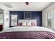 Comfortable main bedroom featuring a decorative accent wall and ample natural light at 1835 S Rockwell St, Gilbert, AZ 85295