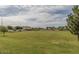 Expansive green space with manicured lawn and mature trees, creating a serene and inviting community atmosphere at 1835 S Rockwell St, Gilbert, AZ 85295