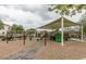 Community playground featuring swings, slides and shade; a perfect place for children to play and enjoy the outdoors at 1835 S Rockwell St, Gilbert, AZ 85295