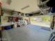 Spacious garage with ample storage racks and an open view of the house exterior at 18427 E Verde Ct, Gold Canyon, AZ 85118