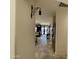 Hallway leading to dining room and kitchen, showcasing an open floor plan and easy access at 18427 E Verde Ct, Gold Canyon, AZ 85118