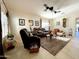 Comfortable living room featuring neutral walls, tile floors, and a ceiling fan for a cozy atmosphere at 18427 E Verde Ct, Gold Canyon, AZ 85118
