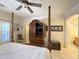 Spacious main bedroom featuring a large television cabinet, ceiling fan, and light-filled windows at 18427 E Verde Ct, Gold Canyon, AZ 85118