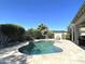 Backyard oasis featuring a stunning pool, lush landscaping, and serene lounging areas at 18427 E Verde Ct, Gold Canyon, AZ 85118