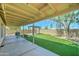Inviting backyard featuring synthetic grass, a covered patio, and pergola at 19808 N 3Rd Ave, Phoenix, AZ 85027
