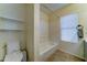 Bright bathroom with a combined tub and shower and tile floors at 19808 N 3Rd Ave, Phoenix, AZ 85027