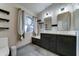 Updated bathroom featuring dual vanities, stylish mirrors, and modern fixtures at 19808 N 3Rd Ave, Phoenix, AZ 85027