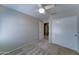 Bedroom with a ceiling fan, and view of the closet and door to the next room at 19808 N 3Rd Ave, Phoenix, AZ 85027