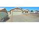 Traditional-style home with desert landscaping, a private drive and an attached garage at 19808 N 3Rd Ave, Phoenix, AZ 85027