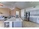 Open-concept kitchen with stainless appliances and a central island with barstool seating at 19808 N 3Rd Ave, Phoenix, AZ 85027