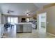 Bright, airy kitchen with central island and stainless appliances overlooks the living area at 19808 N 3Rd Ave, Phoenix, AZ 85027