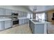 Contemporary kitchen with stainless steel appliances and gray cabinets for a modern look at 19808 N 3Rd Ave, Phoenix, AZ 85027