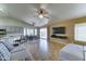 Open living area featuring a large TV, tile floors, and access to the backyard at 19808 N 3Rd Ave, Phoenix, AZ 85027