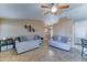 Comfortable living area with modern decor, ceiling fan and tile flooring at 19808 N 3Rd Ave, Phoenix, AZ 85027