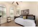 Comfortable bedroom with a ceiling fan, and a day bed by the window at 20750 N 87Th St # 1065, Scottsdale, AZ 85255