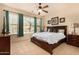 Comfortable bedroom features large windows, a ceiling fan, and a cozy bed at 20750 N 87Th St # 1065, Scottsdale, AZ 85255