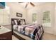 Cozy bedroom with shutters on the windows, ceiling fan, and a queen size bed at 20750 N 87Th St # 1065, Scottsdale, AZ 85255