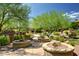 Community pool area featuring lush landscaping, comfortable seating, and ample shade at 20750 N 87Th St # 1065, Scottsdale, AZ 85255