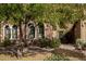 Charming stone home with arched windows and beautiful landscaping at 20750 N 87Th St # 1065, Scottsdale, AZ 85255