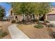 Beautiful home featuring a stone exterior, manicured landscaping, and an inviting walkway at 20750 N 87Th St # 1065, Scottsdale, AZ 85255