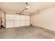Spacious two-car garage featuring an automatic door opener and ample room for storage at 20750 N 87Th St # 1065, Scottsdale, AZ 85255