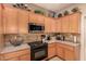 Well-equipped kitchen with modern appliances, tile backsplash, and ample cabinet space at 20750 N 87Th St # 1065, Scottsdale, AZ 85255